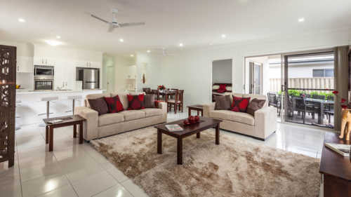 Spacious living and dining rooms open on to the covered alfresco area