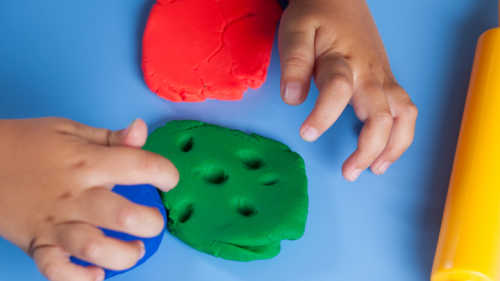 Child playing with modeling clay