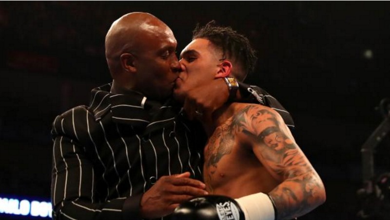 Nigel Benn plants a kiss on his son Conor. 