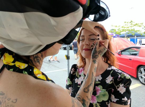 Tash Farrar puts make-up on Crystal Brady.