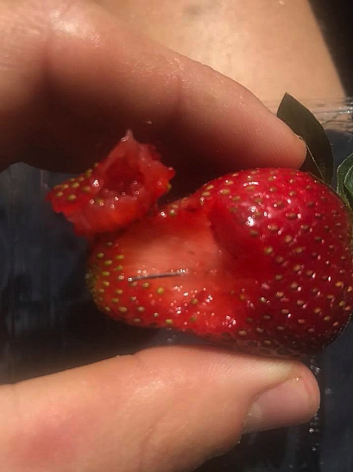 Needles have been found in strawberries sold in Woolworths stores.