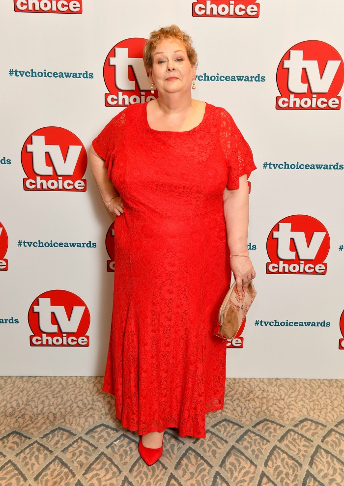 Anne Hegerty looked stunning as she stepped out in a vibrant red dress for the TV Choice Awards in London in September. 