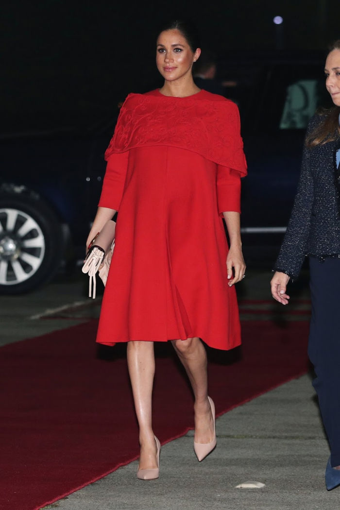 Meghan looked stunning in a vibrant red dress by Valentino. Source: Getty.