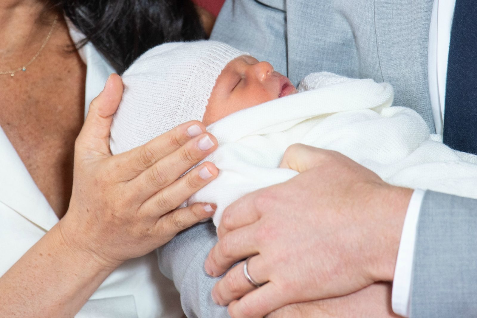 Prince Harry and Meghan have shared their first photos of Archie Harrison Mountbatten-Windsor with the world.