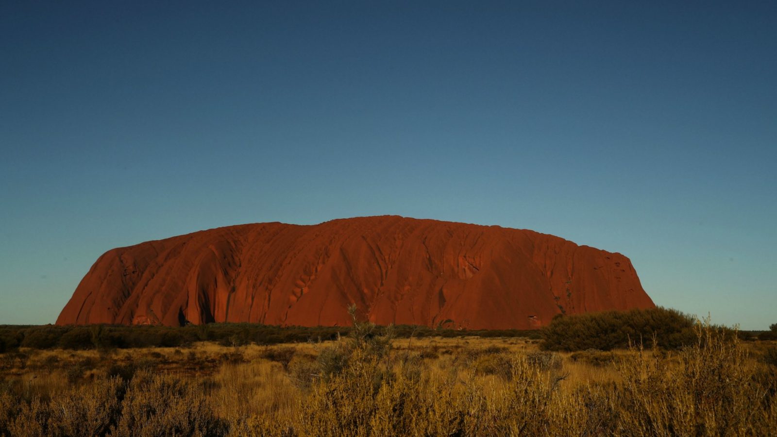 While the days are sunny, the crisp winter nights at Uluru can drop below zero. Be sure to dress warmly for sunrise and sunset activities. Source: Getty.