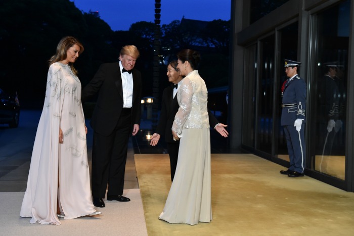 Melania Trump looked stunning in a long white gown alongside her husband US President Donald Trump as they were greeted by Japan's Emperor Naruhito and Empress Masako for a state banquet. 