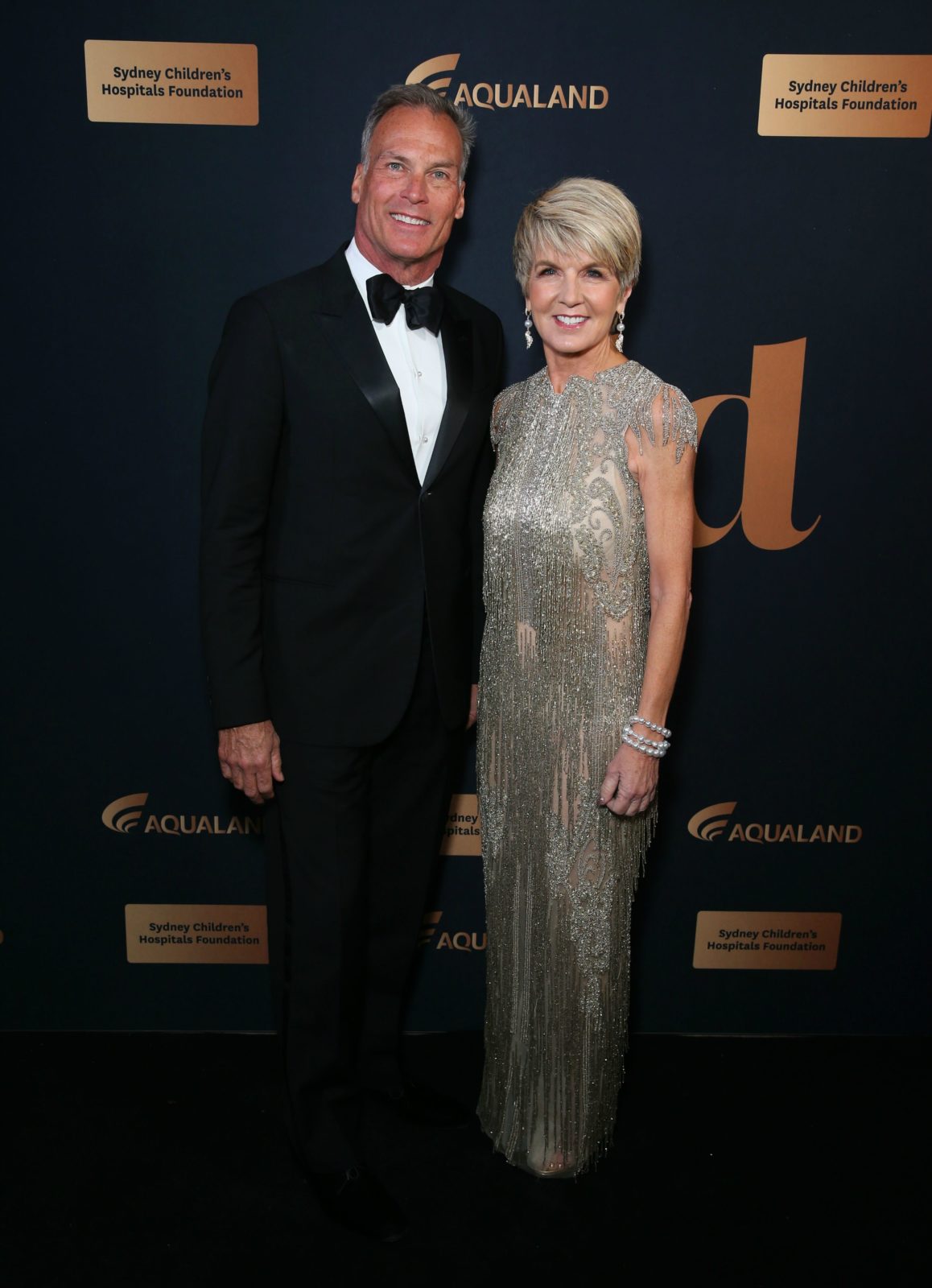 Julie Bishop wowed in a silver metallic dress alongside partner David Panton. Source: Getty.