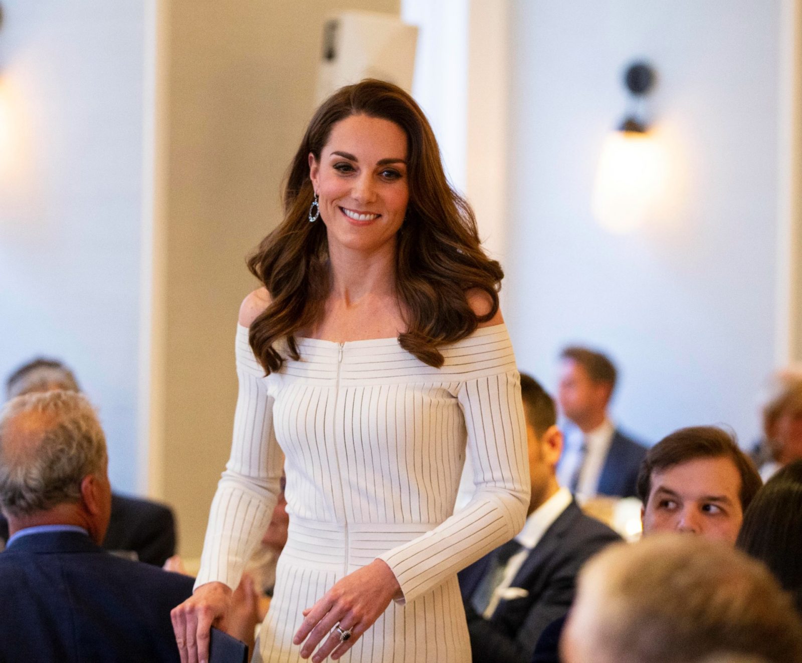 Kate Middleton in a stylish white dress