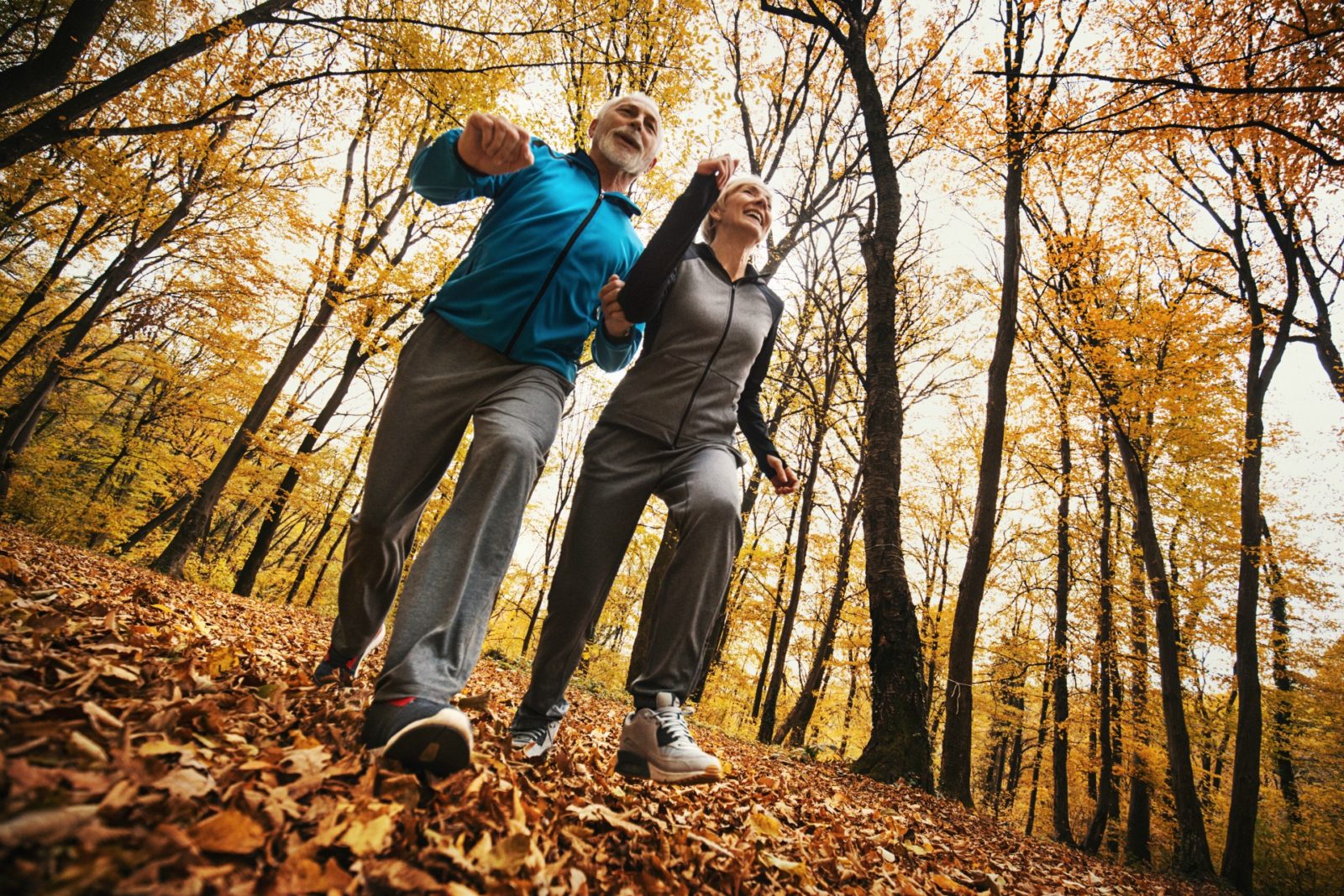 Elderly couple exercising to beat bloating