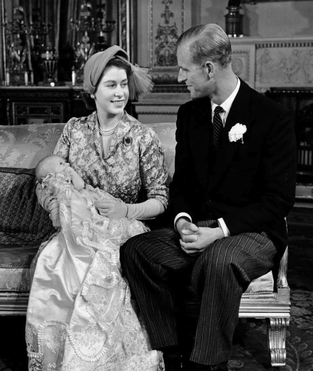 Princess Anne is held by the Queen in Buckingham Palace in 1950. Source: Getty.