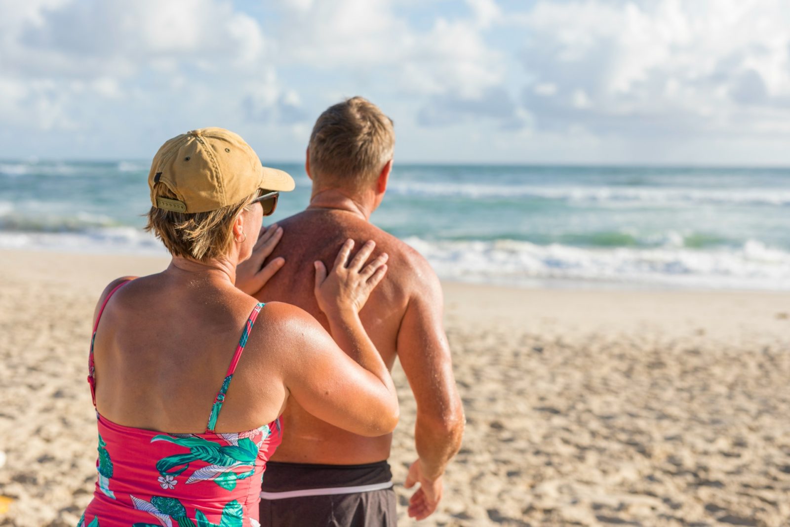 Older couple beach sunscreen