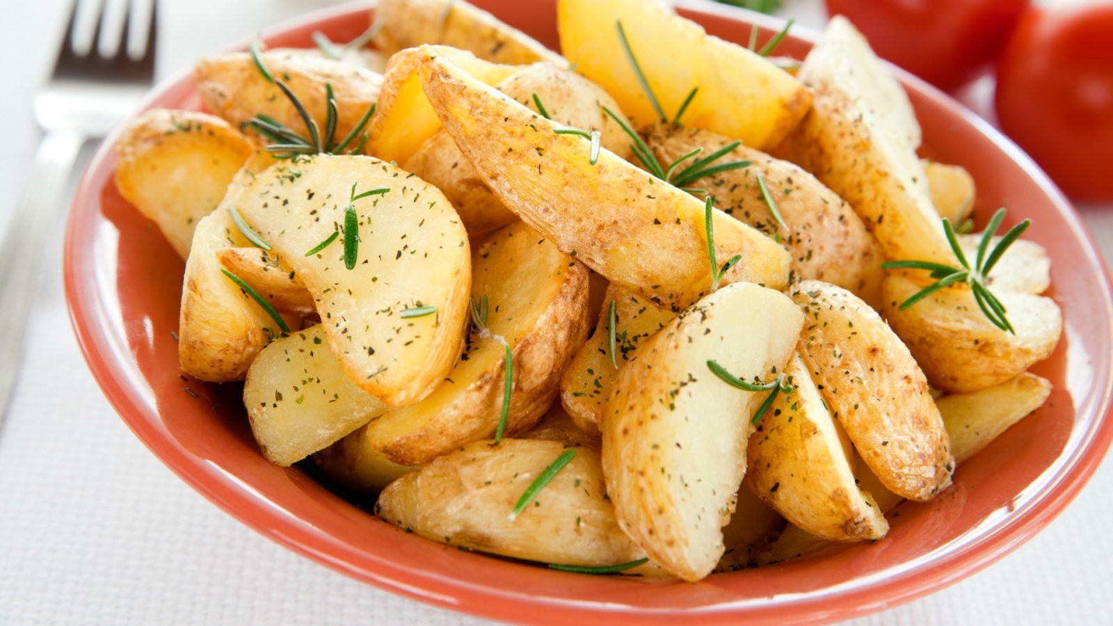 Roasted potatoes with rosemary in a bowl