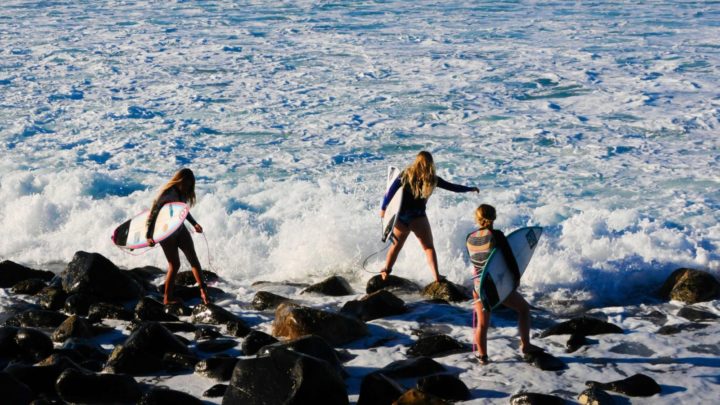 Surfers at Lennox Head, NSW