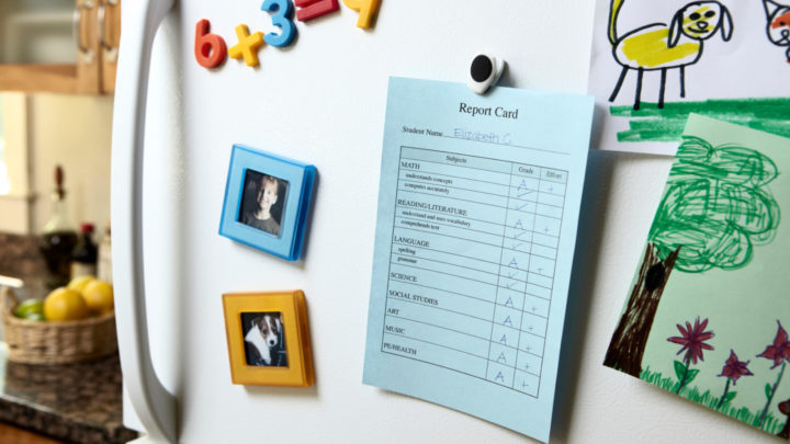 Sally's teacher had written a message on the back of the report card. Source: Getty.
