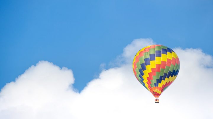 The man below says: “Yes, you’re in a hot air balloon, hovering 30 metres above this field”. Source: Pexels.