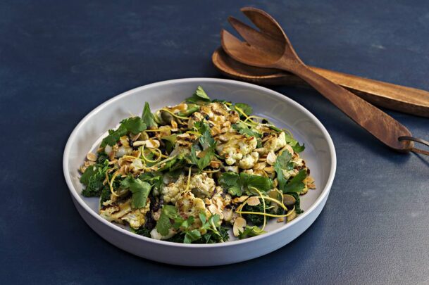 Grilled cauliflower salad with almonds, kale and currants