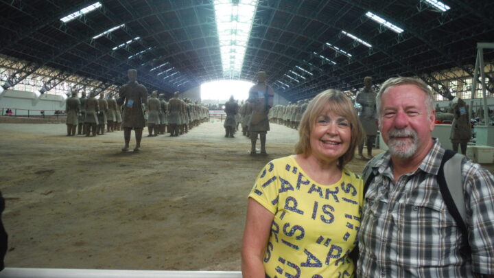 Wendy and her husband David pose for a photo in front of the terracotta warriors in Xi'an, China. 