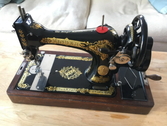 A beautifully maintained antique black-and-gold Singer sewing machine. Source: Reddit