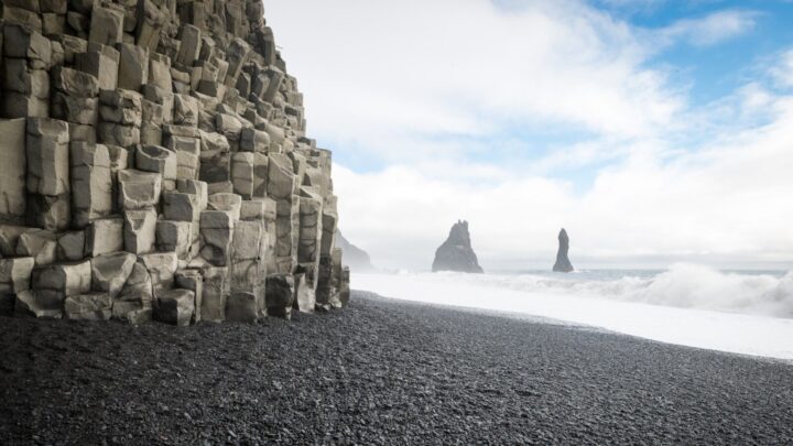 Reynisfjara beach with it's black volcanic sands, smooth pebbles, unique rock formations and overall moody atmosphere is located on the south coast of Iceland. Source: Getty Images