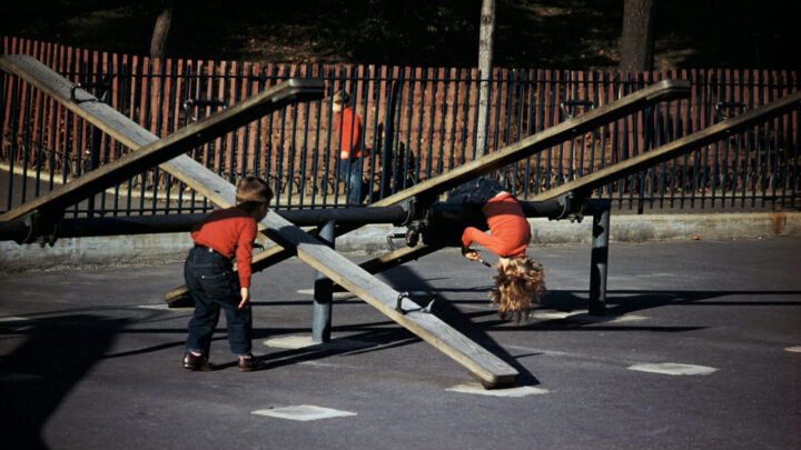 Children playing on see-saws at a playground in 1952. Source: Getty