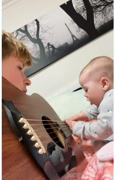 Robert Irwin teaches niece Grace Warrior to play the guitar. Source: @robertirwinphotography/Instagram