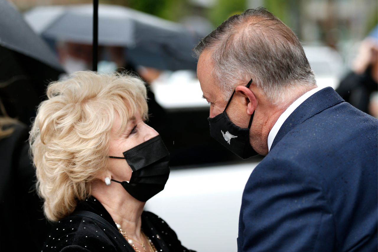 Patti Newton is consoled by Opposition Leader Anthony Albanese. Source: Getty