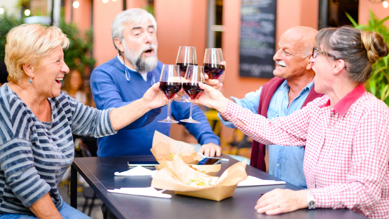 Elderly group having dinner together.