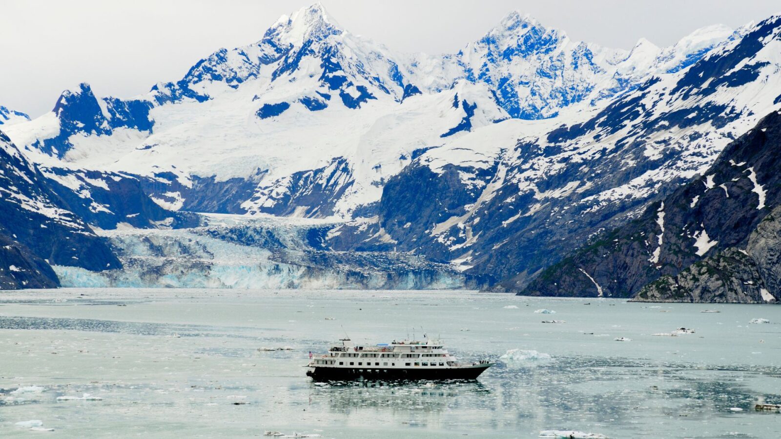 A ship cruising around Alaska.