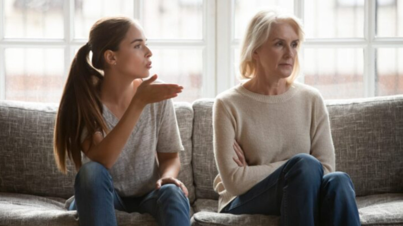 younger and older people arguing.