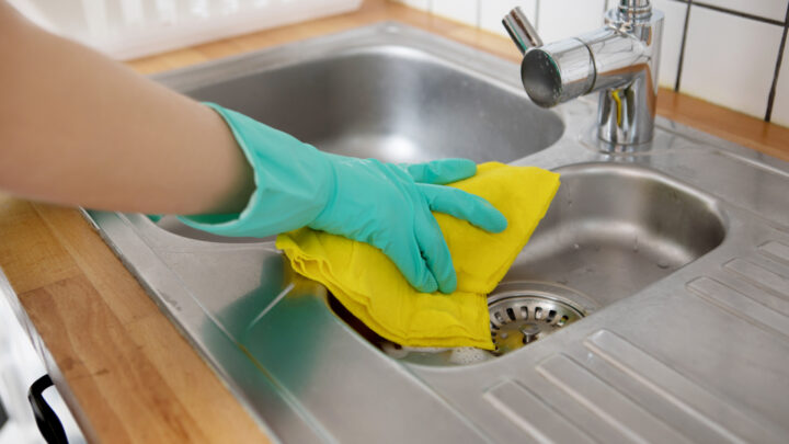 where we hang those handy wipes once we finish our tidy-up could be causing more harm than good, and many of us are damaging our kitchen surfaces. Image source: Getty Images.