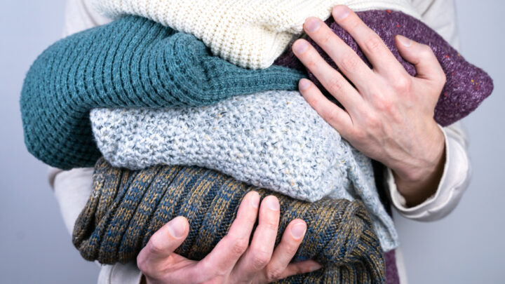 Lint rollers, soda water, and sturdy hangers: The surprising secrets to keeping your winter woollies flawless. Source: Getty Images. 