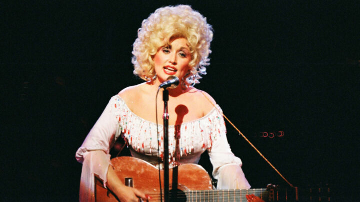 Dolly Parton opens up about grief, love, and why music just isn’t possible right now. Source: Pete Still/ Redferns/ Getty Images. 
