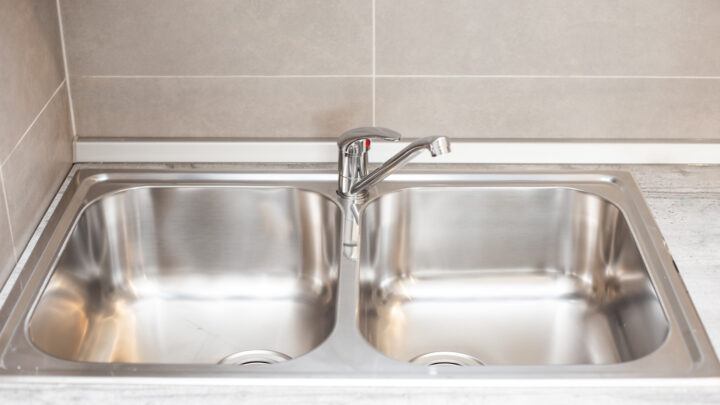 Make your kitchen sink shine like new with tips from a cleaning expert. Source: Shutterstock