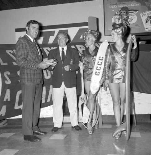  Mr McKinney, Mayor Ald. Small, with Surfers Paradise Meter Maids, Antonette Stengel and Angela Scott for the promotional launch of a Gold Coast produced surfing safety brochure, Gold Coast, Queensland, June 1972 . Photo: Bob Avery; City of Gold Coast Local Studies Library